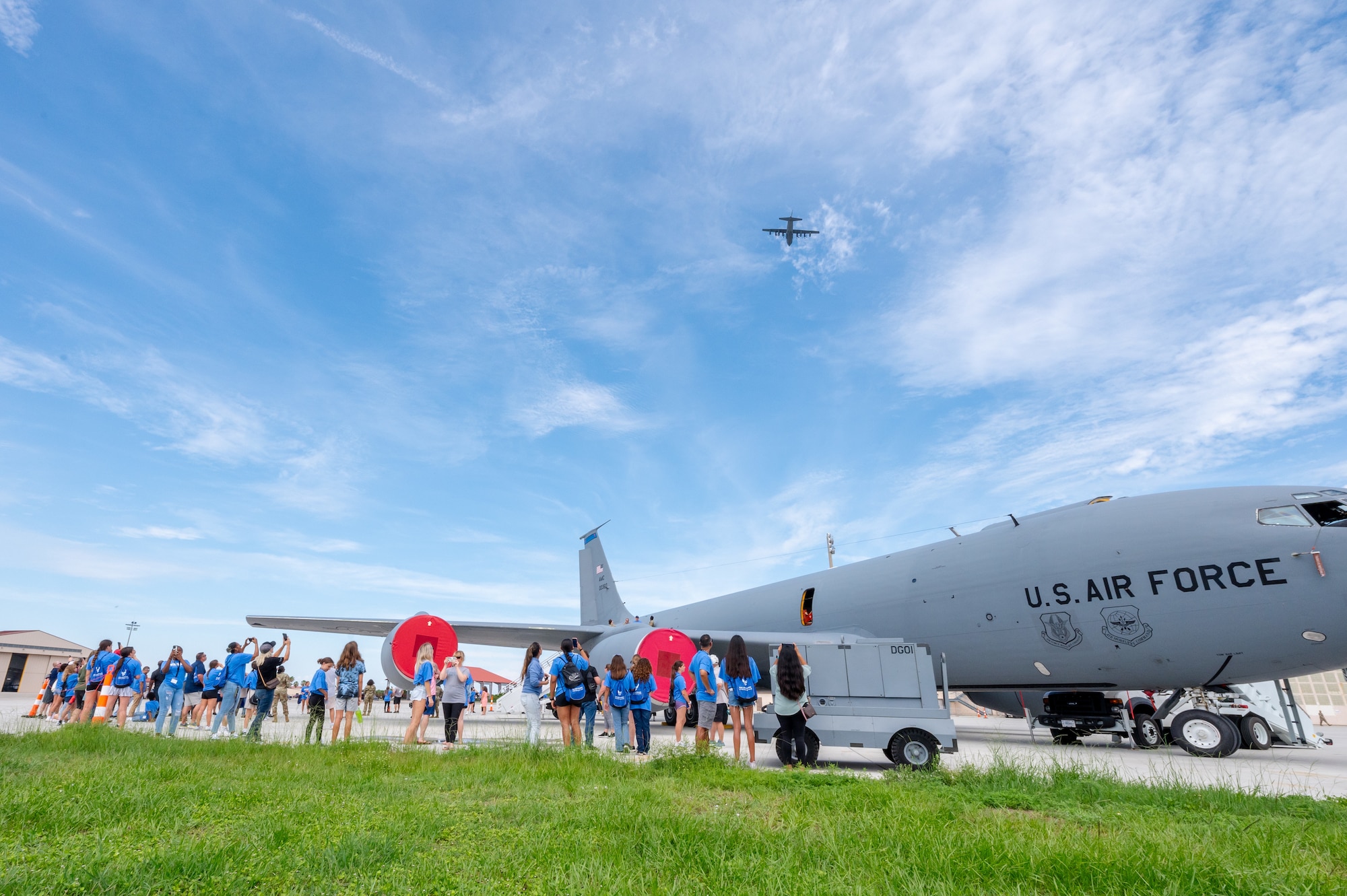 A group of participants look at a cargo plane.