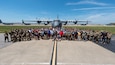 More than 200 current and former members of the Kentucky Air National Guard pose in front of a 123rd Airlift Wing C-130J Super Hercules aircraft at the Kentucky Air National Guard Base on June 28, 2024, during a luncheon to celebrate the unit’s heritage. The event represented more than 3,000 years of aircraft maintenance experience. (U.S. Air National Guard photo by Phil Speck)