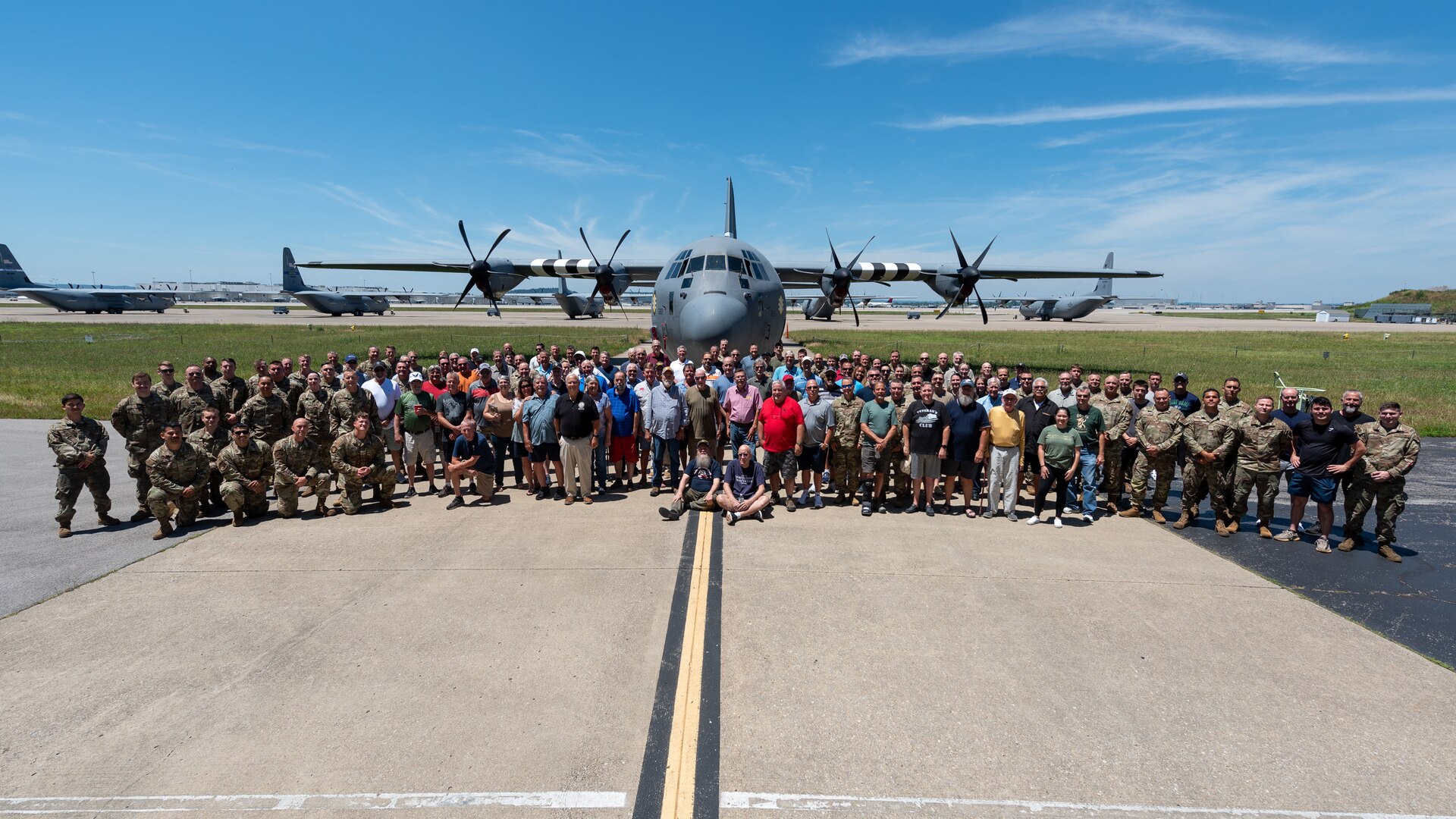 More than 200 current and former members of the Kentucky Air National Guard pose in front of a 123rd Airlift Wing C-130J Super Hercules aircraft at the Kentucky Air National Guard Base on June 28, 2024, during a luncheon to celebrate the unit’s heritage. The event represented more than 3,000 years of aircraft maintenance experience. (U.S. Air National Guard photo by Phil Speck)