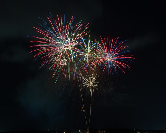 Fireworks explode over Back Bay during Freedom Fest 2024 at Keesler Air Force Base, Mississippi, July 3, 2024. The event included a live band, a various competitions, gaming area, food eating competitions and a fireworks show. (U.S. Air Force photo by Jon Carter)