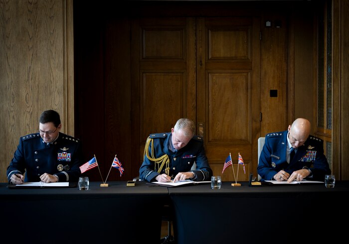 U.S. Space Force Chief of Space Operations Gen. Chance Saltzman, Royal Air Force Chief of the Air Staff Air Chief Marshal Sir Rich Knighton, and U.S. Air Force Chief of Staff Gen. David Allvin sign a Shared Vision Statement on Combined Air and Space Power in the 21st Century at the RAF’s Global Air & Space Chiefs’ Conference in London, United Kingdom, July 17, 2024.