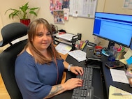 Jasmin Müller, a host nation employee with the Base Support Operations Transportation Division, examines the paperwork for an outbound transportation shipment at her office. The wealth of experience and expertise within the 405th Army Field Support Brigade’s host nation workforce is staggering, and Müller is one of many local national employees who consistently demonstrate extraordinary competencies.