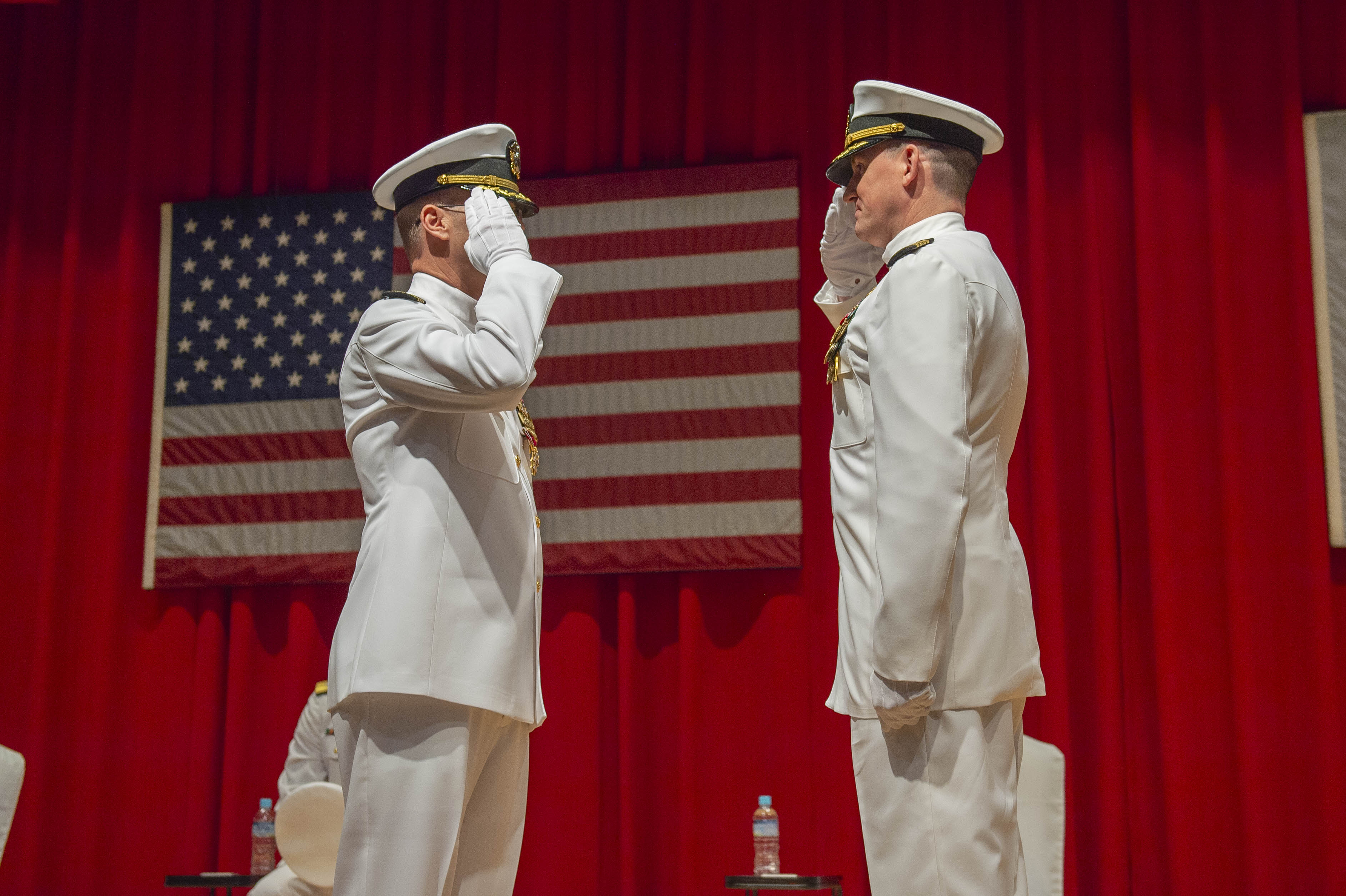 Capt. Matthew Tolhurst, right, relieves Capt. Lance Flood, Naval Facilities Engineering Systems Command (NAVFAC) Far East, during the NAVFAC Far East change of command ceremony at Commander, Fleet Activities Yokosuka (CFAY) July 12, 2024.