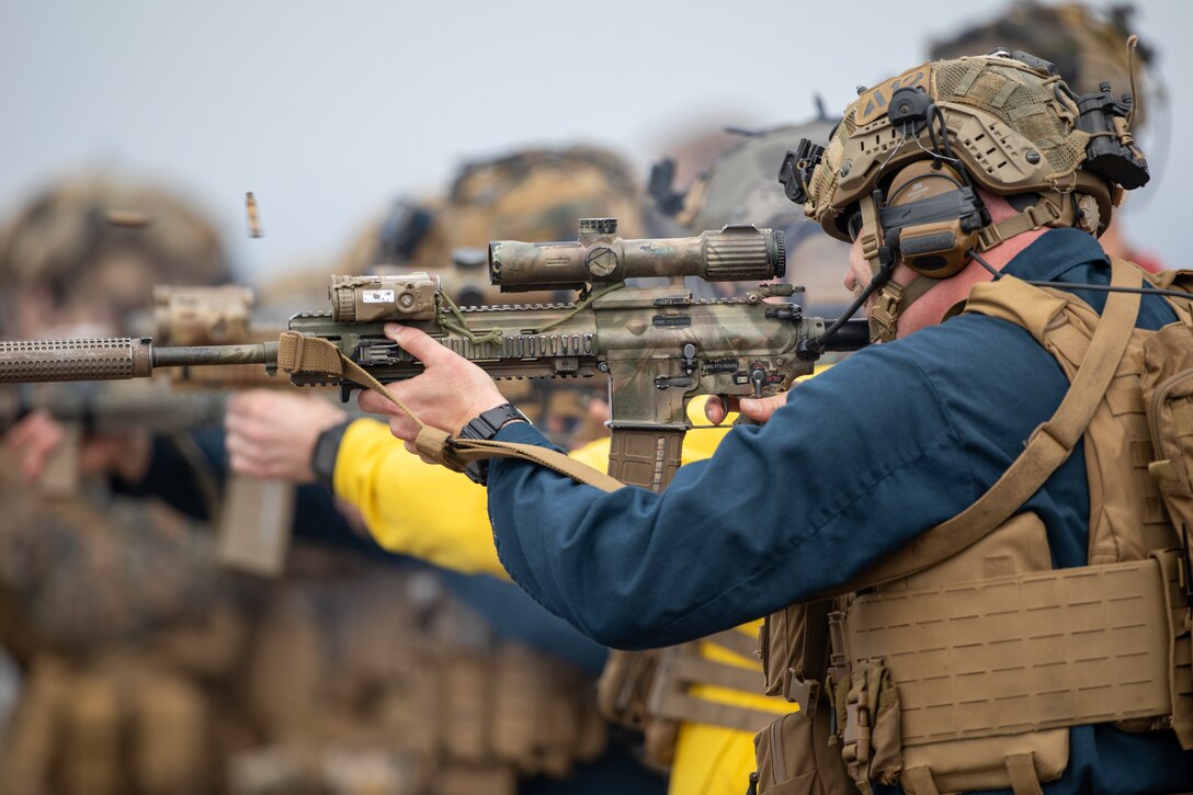 U.S. Marines with Battalion Landing Team 1/8, 24th Marine Expeditionary Unit (MEU) Special Operations Capable (SOC), and Sailors assigned to the amphibious assault ship USS Wasp (LHD 1) fire at their targets during weapons familiarization training on the flight deck while underway in the Mediterranean Sea, June 27, 2024. The Wasp Amphibious Ready Group-24th MEU (SOC) is conducting operations in U.S. Naval Forces Europe area of operations to support high-end warfighting exercises while demonstrating speed and agility operating in a dynamic security environment. (U.S. Marine Corps photo by Cpl. Elton Taylor)