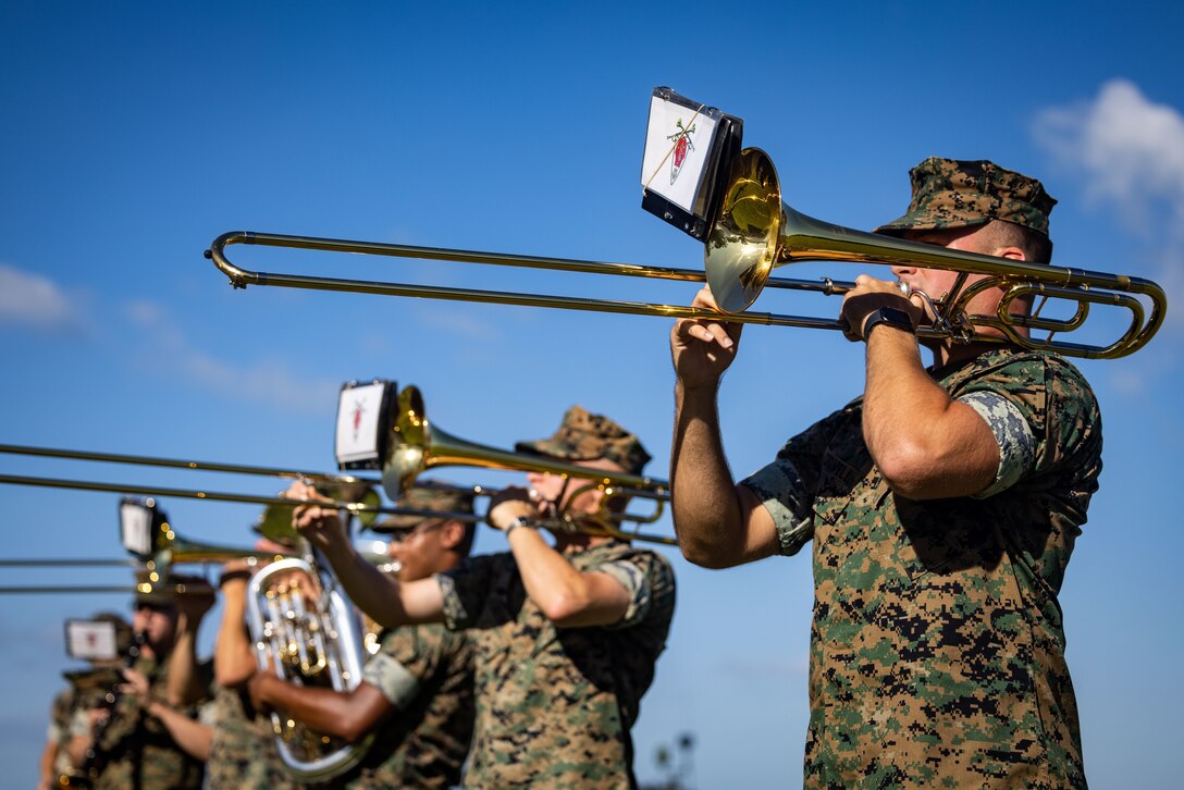 U.S. Marines with the 2nd Marine Division Band play music during a change of command ceremony at Marine Corps Base Camp Lejeune, North Carolina, July 3, 2024. This change of command ceremony represented the transfer of authorities and responsibilities from Lt. Col. Siclari to Lt. Col. Gwin. (U.S. Marine Corps photo by Sgt. Nathan Mitchell)