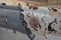 HSC-9 showcase traditional naval tattoos on their ceremonial aircraft.