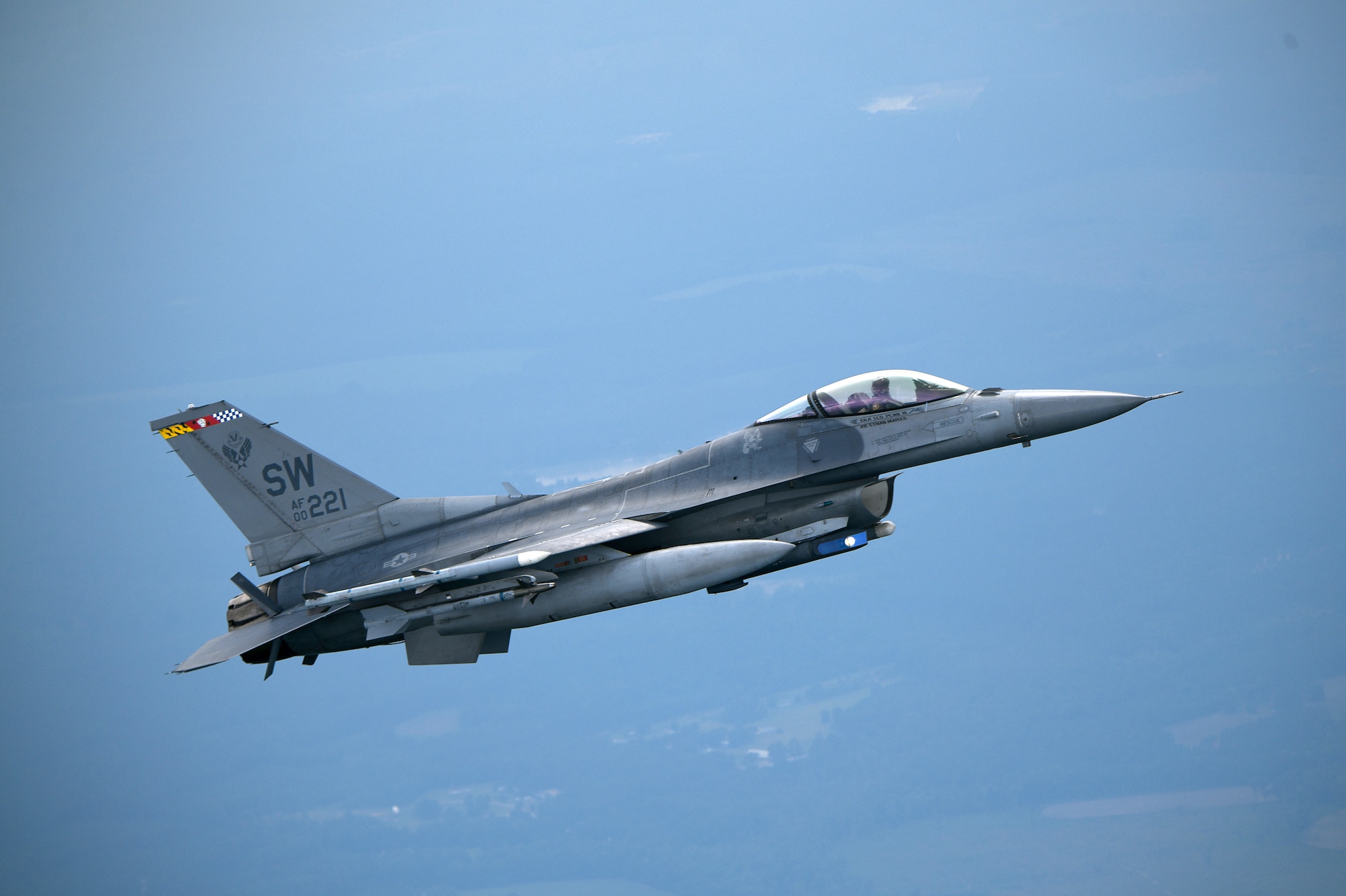 A U.S. Air Force F-16C Fighting Falcon assigned to the 79th Fighter Squadron participates in intercept training over South Carolina, June 27, 2024. Throughout the training, 79th FS pilots practiced communications-out visual signals such as wing rocking, flashing navigation lights and deploying flares to gain the attention of an encroaching aircraft. (U.S. Air Force photo by Staff Sgt. Kelsey Owen)