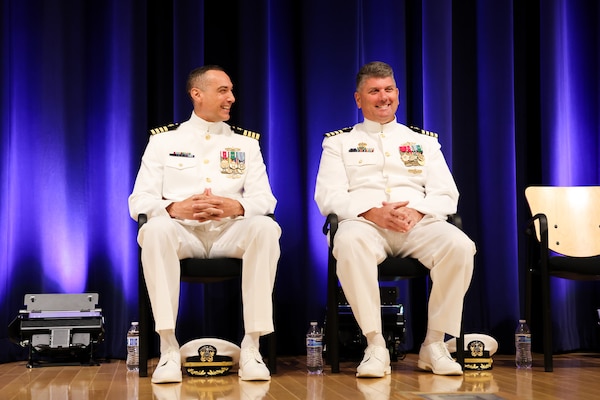 Former Commanding Officer Capt. Matthew Tardy (right) sits with New Commanding Officer Capt. Christopher Matassa during the Change of Command Ceremony at Naval Surface Warfare Center, Carderock Division in West Bethesda, Md., on July 17, 2024.