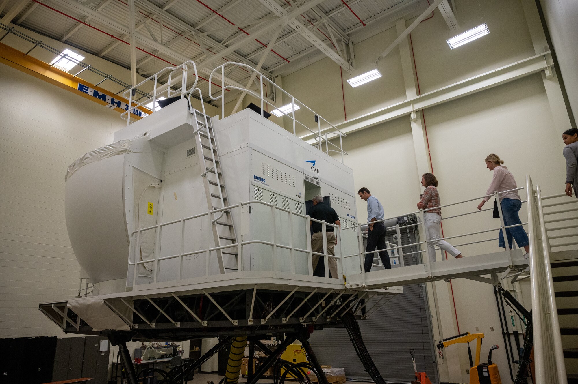 Congressman Chris Deluzio and staff prepare to enter a KC-135 aircraft flight simulator during a tour of the Pennsylvania Air National Guard’s 171st Air Refueling Wing near Pittsburgh, Sept. 5, 2023. During the tour the congressman and staff met with leadership and was briefed on the units mission, capabilities and people. (U.S. Air National Guard Photo by Senior Master Sgt. Shawn Monk)