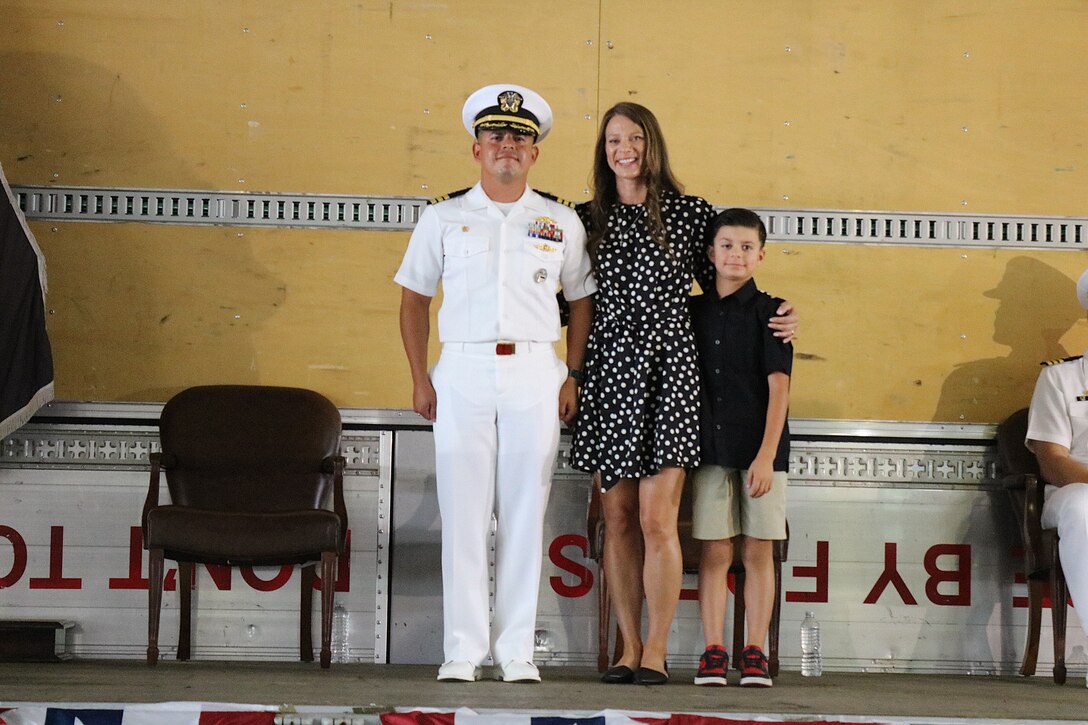various civilian and military employees at a ceremony and reception.