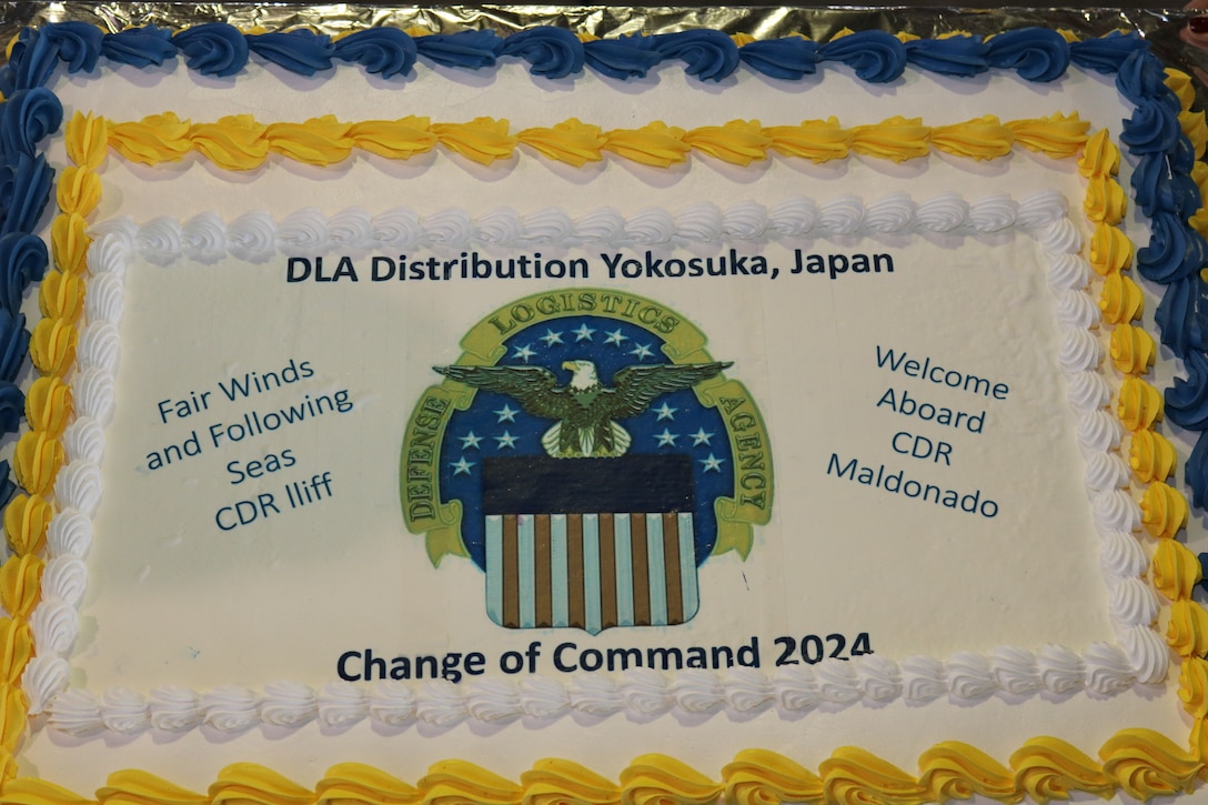 various civilian and military employees at a ceremony and reception.