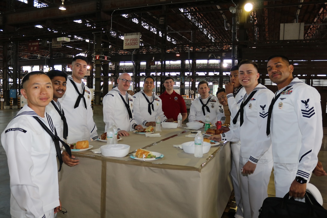 various civilian and military employees at a ceremony and reception.