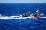 A small boat from Sentinel-class fast response cutter USCGC Richard Dixon (WPC 1113) approaches a suspected migrant vessel approximately 34 miles northwest of Aguadilla, Puerto Rico, July 15, 2024.