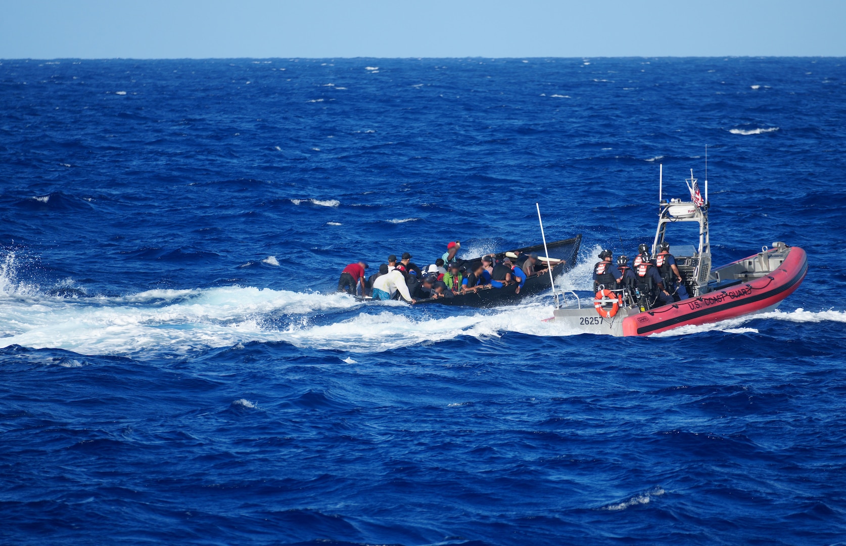 A small boat from Sentinel-class fast response cutter USCGC Richard Dixon (WPC 1113) approaches a suspected migrant vessel approximately 34 miles northwest of Aguadilla, Puerto Rico, July 15, 2024.