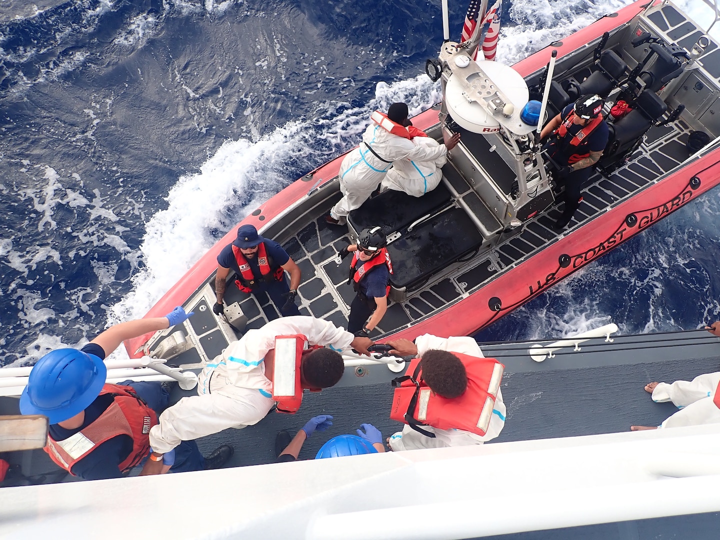 Crew members aboard Sentinel-class fast response cutter USCGC Joseph Tezanos (WPC 1118) disembark migrants to repatriate them to the Dominican Republic Navy, July 17, 2024.