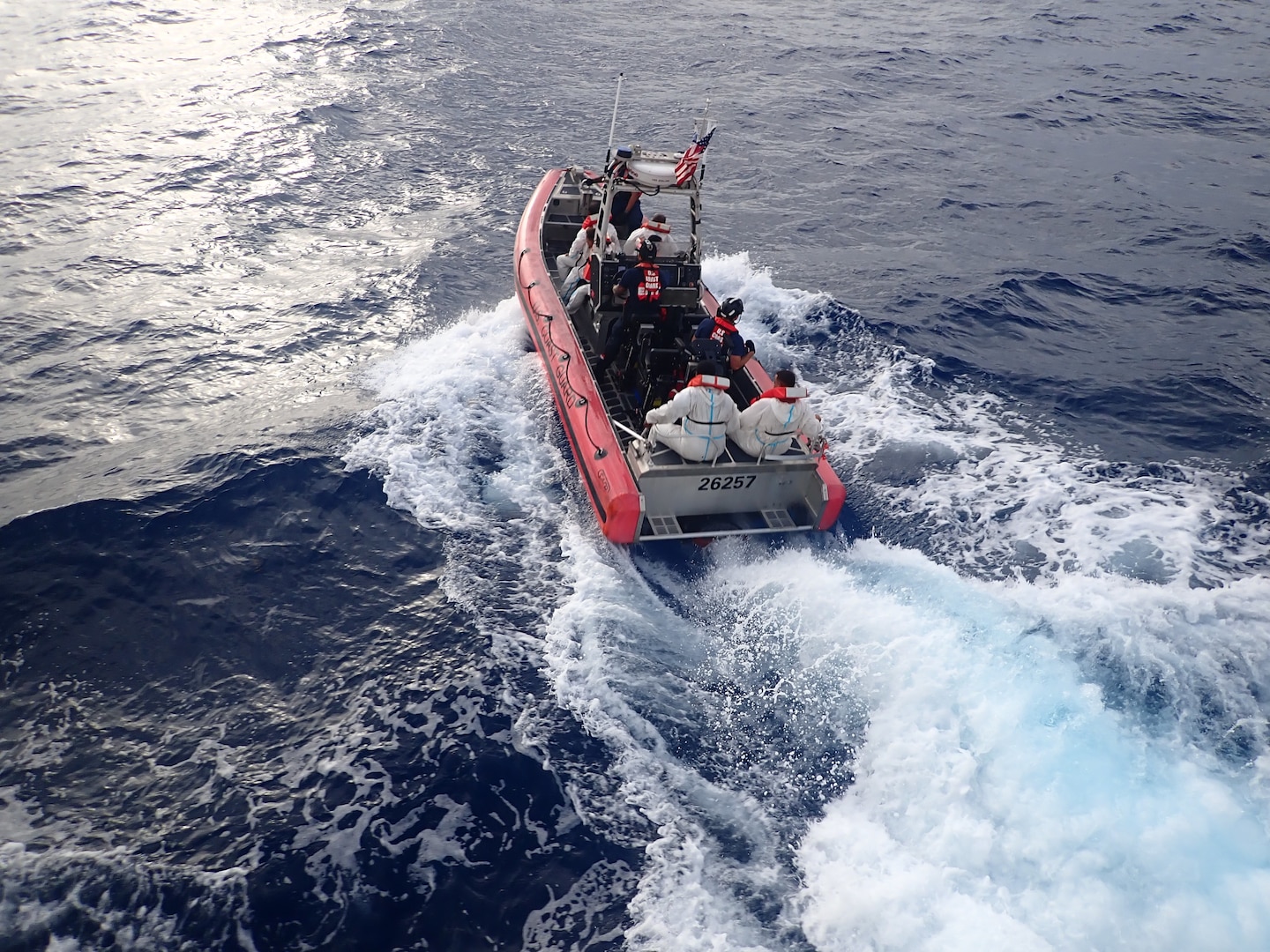 Crew members from Sentinel-class fast response cutter USCGC Joseph Tezanos (WPC 1118) transport migrants to the Dominican Republic Navy for repatriation July 17, 2024.