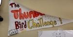 Art by a Thunderbird Challenge Program cadet hangs on the wall.
