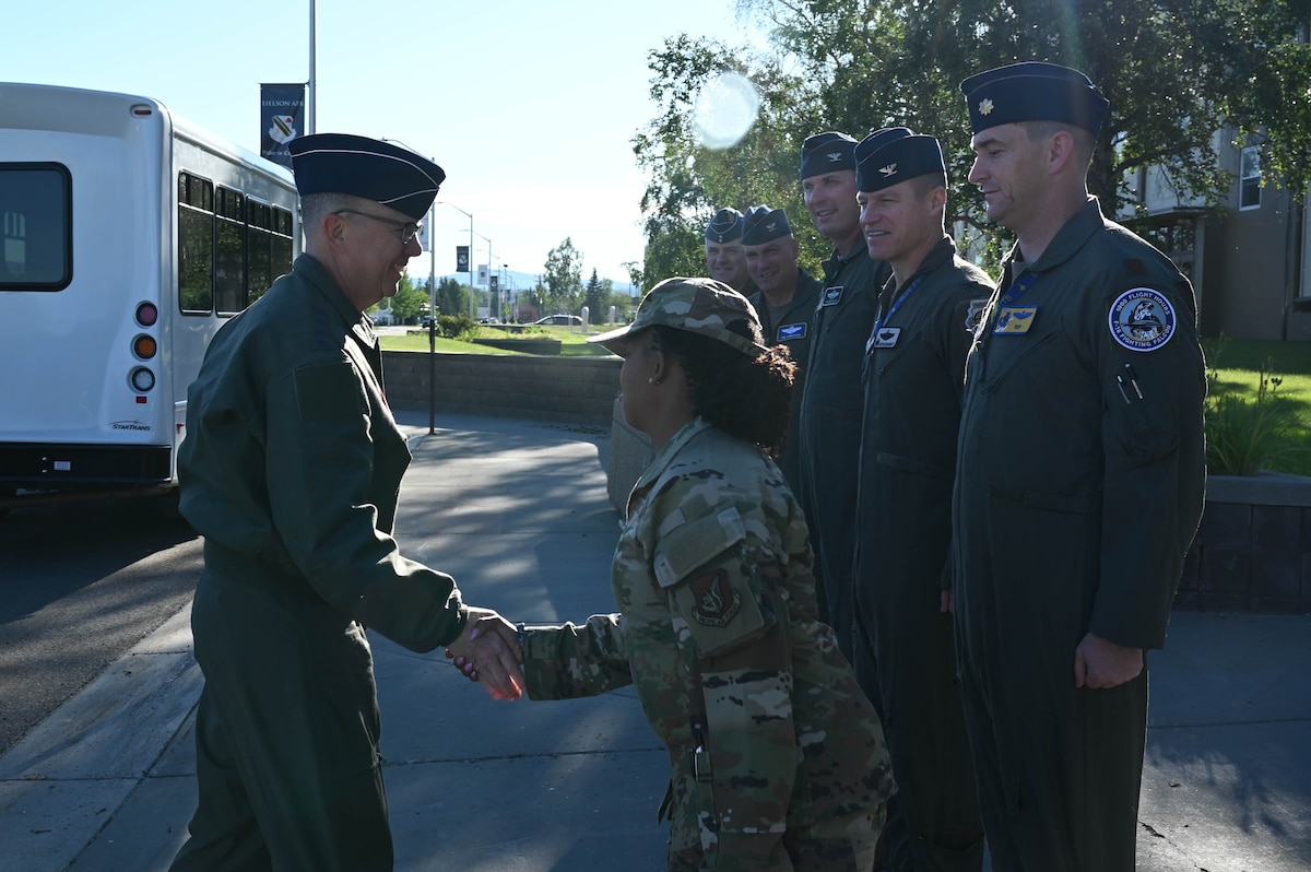 Gen. Guillot shakes the hand of Command Chief, Chief Master Sergeant Blandburg who stands as the first person in a line of base leadership waiting to welcome Gen. Guillot.