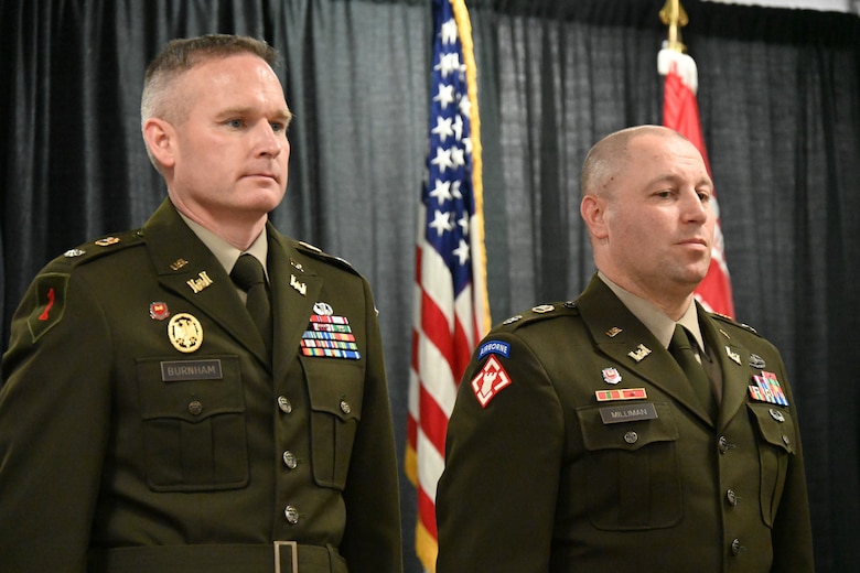 U.S. Army Lt. Col. Robert Burnham stands next to U.S. Army Lt. Col. Lyle Milliman