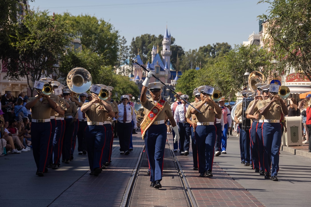 U.S. Marines with the 1st Marine Division Band march down Disneyland’s Main Street in Anaheim, California, July 4, 2024. The 1st MARDIV Band was featured in several parades and stationary performances during the park’s annual Independence Day celebration. (U.S. Marine Corps photo by Cpl. Willow Marshall)