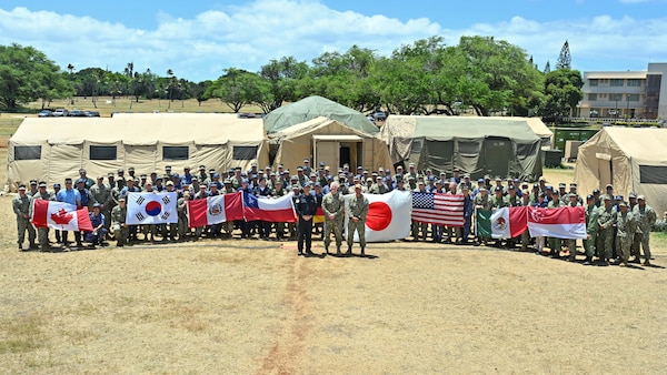 Participants from eight nations pose for a photo, July 15, to mark the end of the Humanitarian Assistance and Disaster Relief (HADR) drill as part of Exercise Rim of the Pacific (RIMPAC) 2024.
