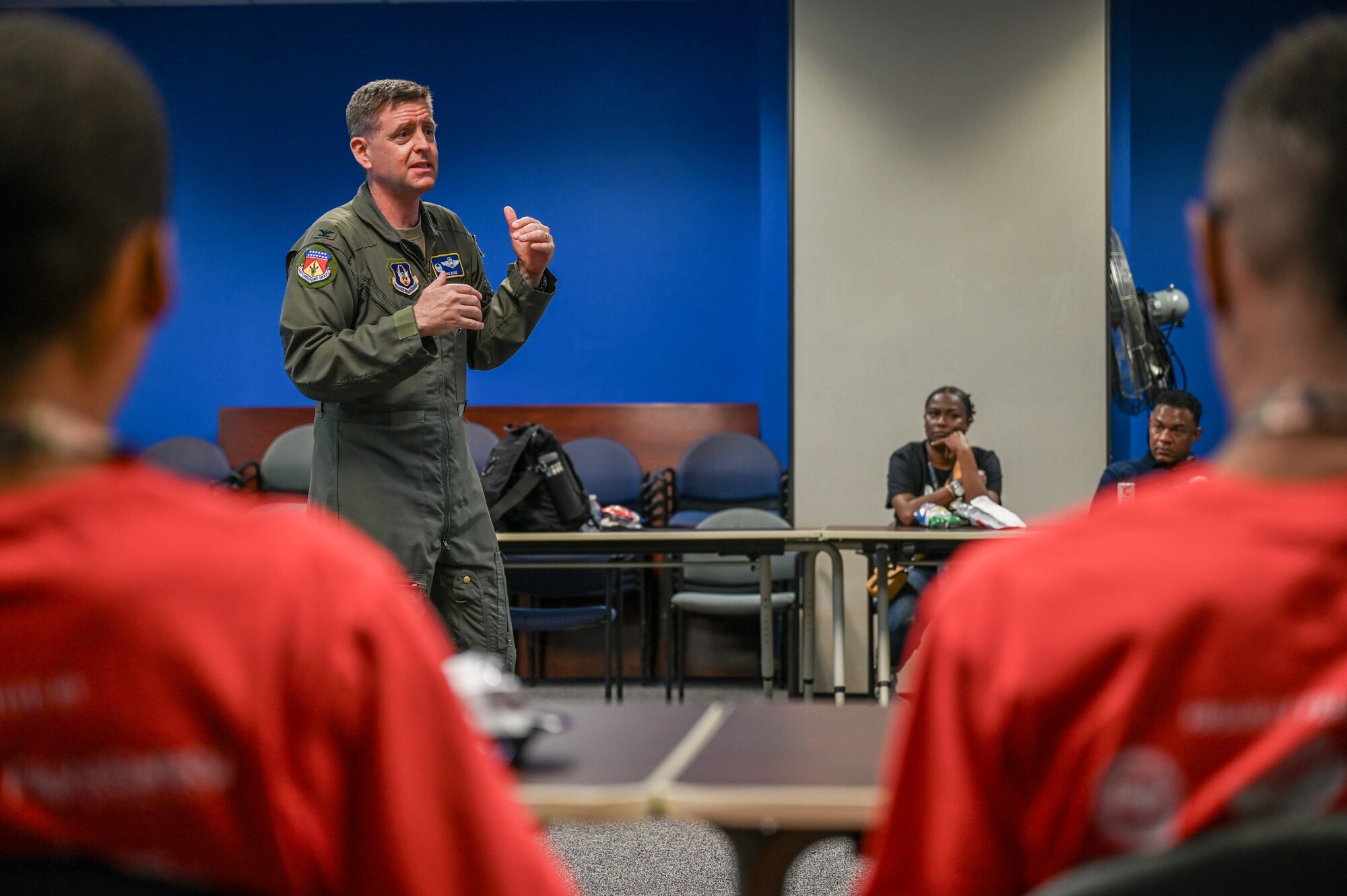 Col. Michael Baker, 445th Airlift Wing Operations Group commander, speaks to young members of Buckeye Tigers about the Air Force Reserve during the group’s visit to the 445th Airlift Wing at Wright-Patterson Air Force Base, Ohio, July 10, 2024. The Buckeye Tigers Aviation Program is an aviation organization focused on exposing young adults in middle and high school to various aviation careers in the Columbus and greater Central Ohio region.  Members get to experience actual flight in a real single engine airplane as the culminating event of OBAP’s (Organization of Black Aerospace Professionals) sponsored A.C.E. (Aviation Career Education) Academy. (U.S. Air Force photo by Mr. Patrick OReilly)