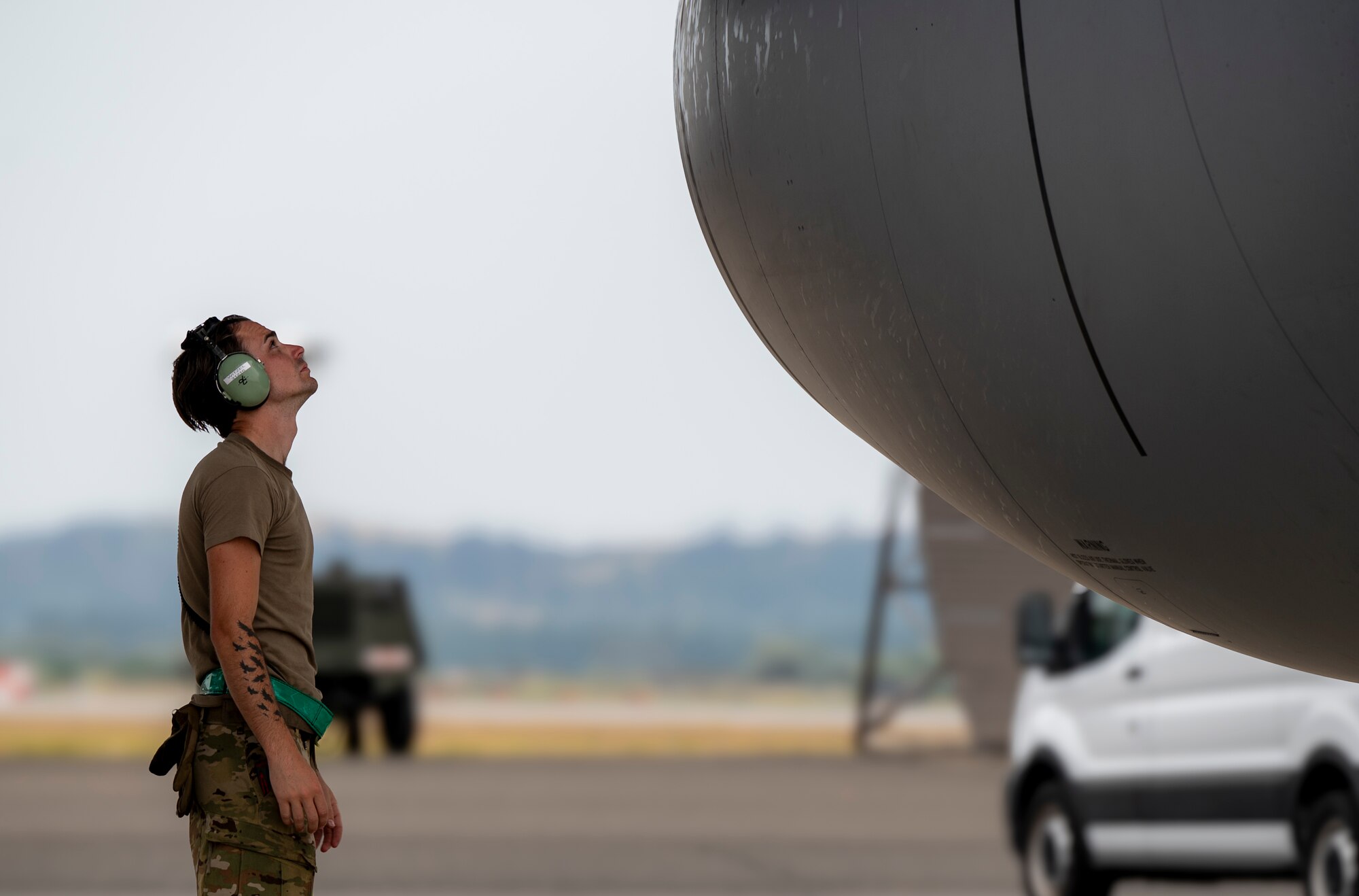 A military member performs an inspection