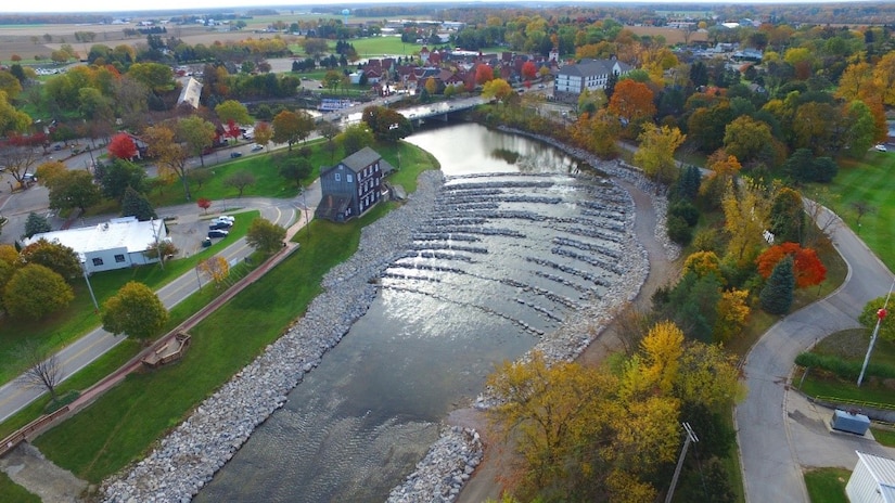 Aerial photo of a stream with a rock ramp.