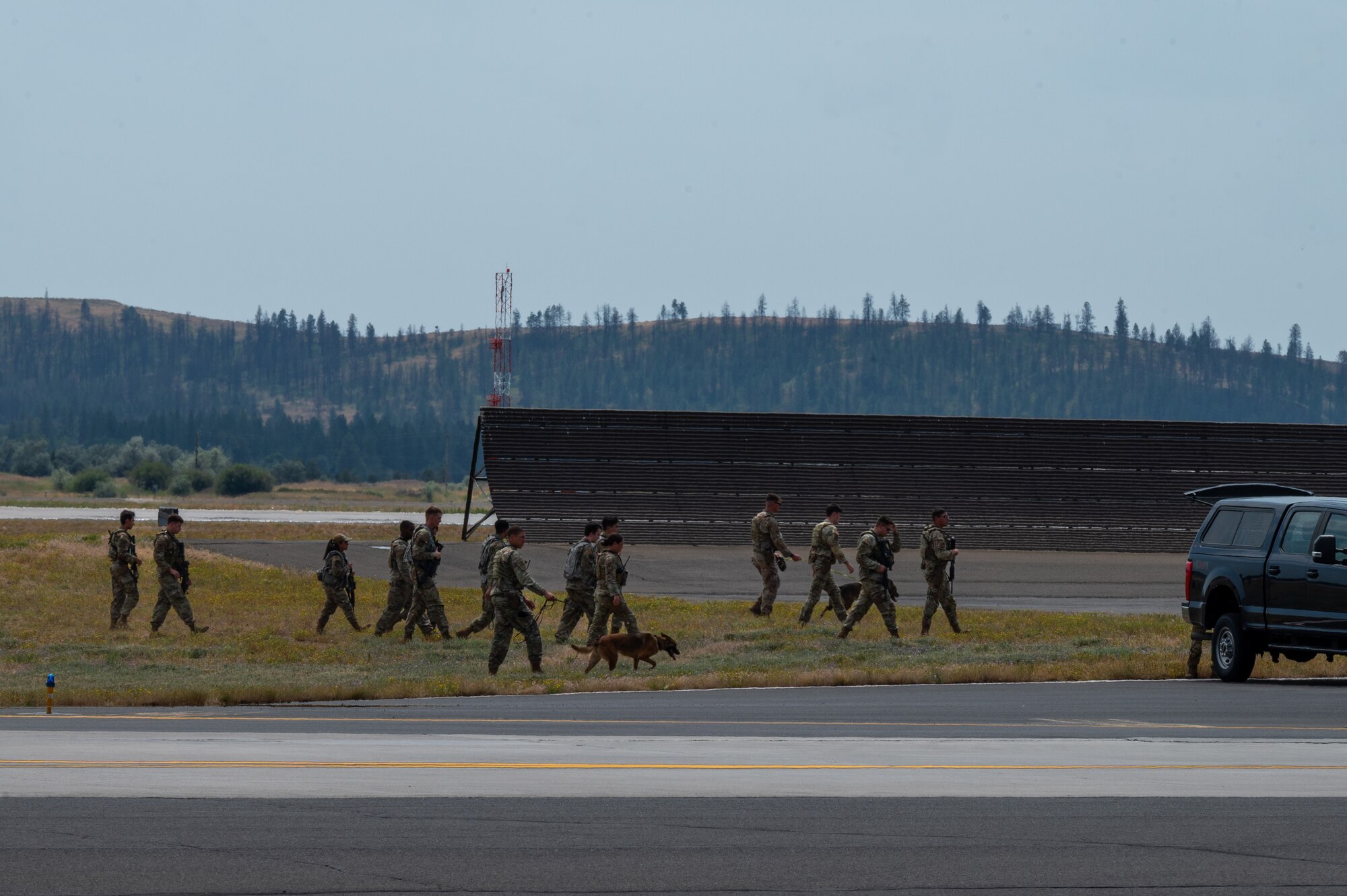 Defenders assigned to the 92nd Security Forces Squadron perform a security sweep on the flightline during a no-notice Nuclear Operational Readiness Inspection at Fairchild Air Force Base, Washington, July 16, 2024. Air Mobility Command's Inspector General team conducted the no-notice NORI from July 16 - 18, during which the 92nd Air Refueling Wing and 141st ARW received same-day notification of the evaluation of the base's capability to perform as a nuclear support unit. Various capabilities at Fairchild AFB enable units to generate and provide, when directed, specially trained and equipped KC-135 Stratotanker aircrews to conduct critical air refueling of U.S. Strategic Command-assigned nuclear-capable bombers and Nuclear Command, Control and Communication aircraft. No-notice inspections validate that Airmen are always postured and ready with a credible force to assure, deter and defend in an increasingly complex security environment. No-notice and limited-notice operational readiness assessments and inspections directly support the plans unveiled by senior Department of the Air Force leaders as the force reoptimizes for Great Power Competition. (U.S. Air Force photo by Airman 1st Class Stassney Davis)