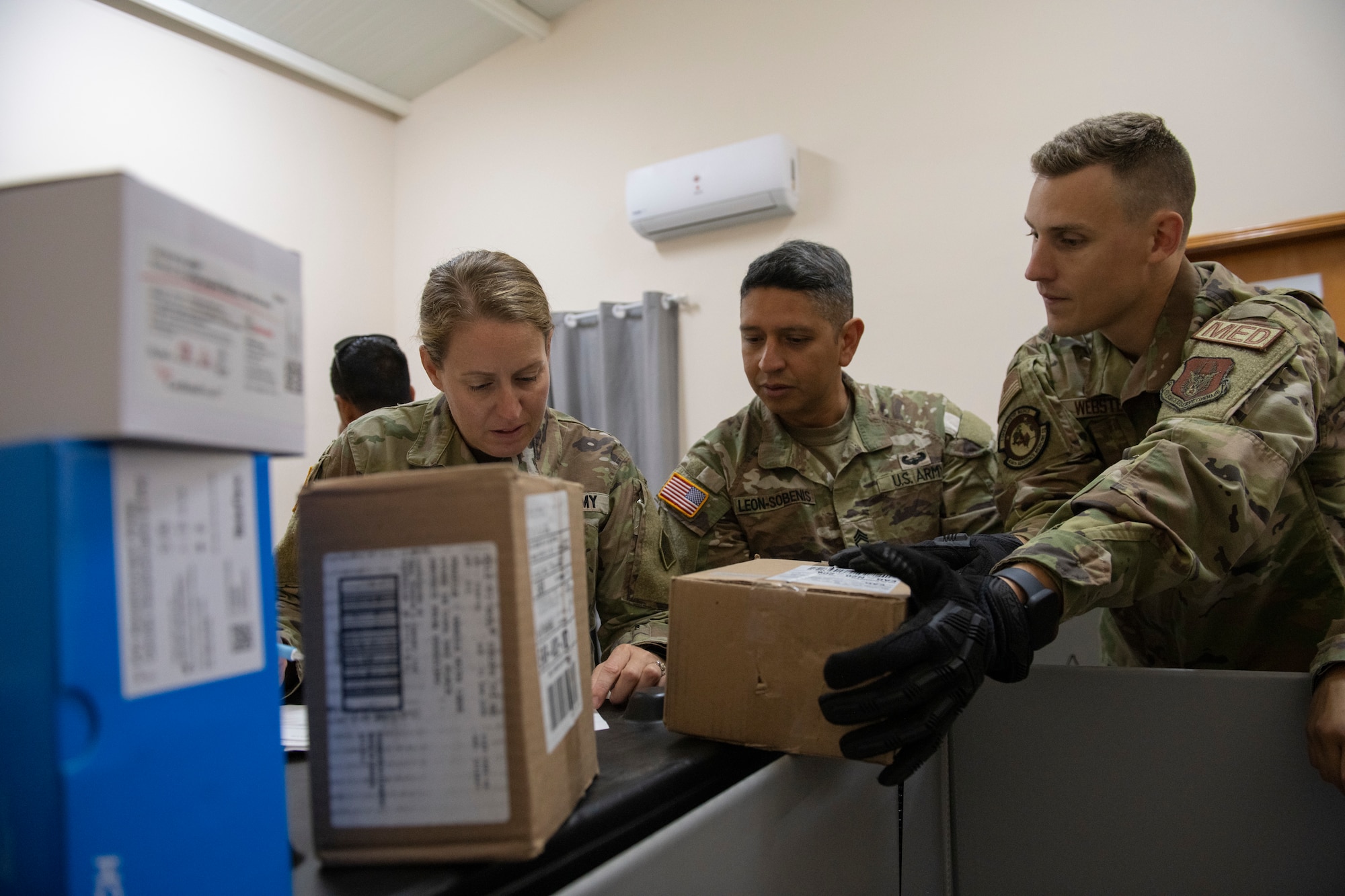 U.S. Army Maj. Meaghan Hart, physician assistant, and Sgt. 1st Class Luis Leon-Sobenis, combat medic specialist, both with the Massachusetts National Guard Medical Command, and U.S. Air Force Tech. Sgt. Ryan Webster, 434th Aerospace Medicine Squadron medical logistics technician, take inventory of medical supplies in preparation for AMISTAD 24, located in Filadelfia, Paraguay, July 16, 2024. These direct patient care missions send joint/total force, multidisciplinary medical and surgical teams to provide care to partner nations, all while learning best practices with host nation medical teams. (U.S. Air Force photo by Tech. Sgt. Brittany A. Chase)
