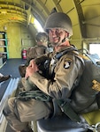 U.S. Army Maj. Michael Frank, executive officer and full-time administrative officer, 2nd Battalion, 135th Aviation Regiment, Colorado Army National Guard, Buckley Space Force Base, Aurora, Colorado, prepares to jump from a C-47 over Normandy, France, during the 80th anniversary celebration of the D-Day invasion, June 5, 2024. (Courtesy photo)