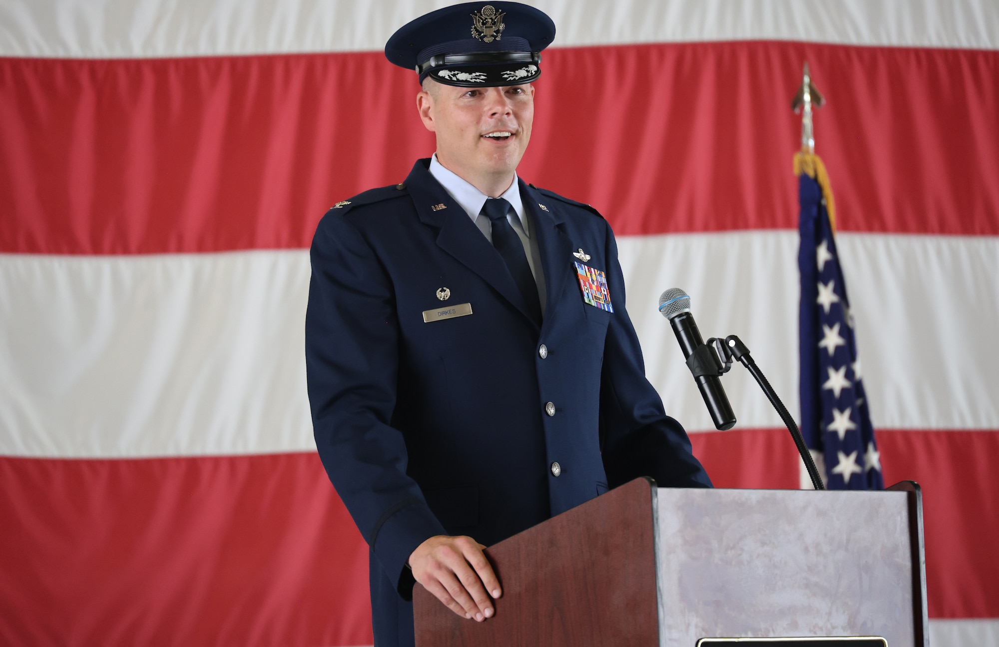 Col. Wayne Dirkes addresses those in attendance to see him become commander of the Arnold Engineering Development Complex 704th Test Group during a Change of Command ceremony July 8, 2024, at the Holloman Air Force Base, New Mexico. (U.S. Air Force photo)