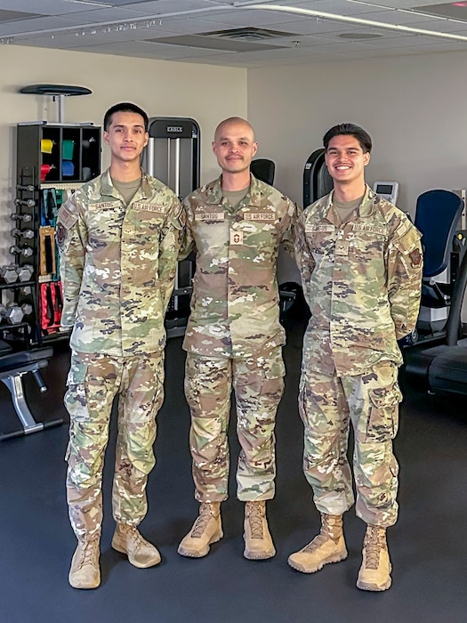 U.S. Air Force Airman 1st Class Nicholas Santos, 375th Medical Group physical therapy technician (left), Chief Master Sgt. Charles Santos, 9th Medical Group senior enlisted leader (center), and A1C Anthony Santos, 81st Medical Group physical therapy technician, pose together at the 9th Medical Group's physical therapy clinic at Beale Air Force Base, California, May 16, 2024.