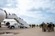 Team Minot Airmen board a passenger jet in preparation for exercise AGILE WARBIRD at Minot Air Force Base, North Dakota, July 13, 2024. AGILE WARBIRD Airmen were distributed to different bases across the U.S. to practice Agile Combat Employment. (U.S. Air Force photo by Senior Airman Alexander Nottingham)