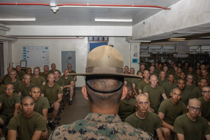 U.S. Marine Corps Staff Sgt. Mario Nunez, a drill instructor with Kilo Company, 3rd Recruit Training Battalion, speaks with his recruits during senior drill instructor square away time at Marine Corps Recruit Depot San Diego, California, July 10, 2024.  SDI time is periodically scheduled to senior enable drill instructors the opportunity to address instructional remediation, core values reinforcement, mentorship, coaching and future training preparation. (U.S. Marine Corps photo by Cpl. Sarah M. Grawcock)