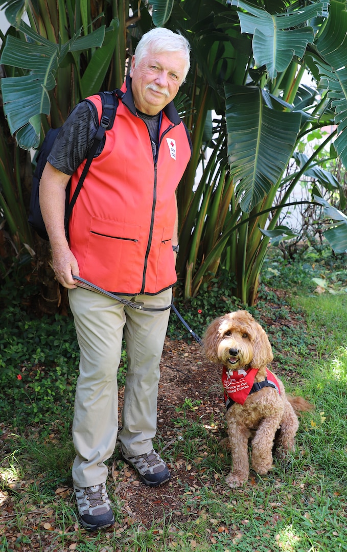 Ruby, a 6-year-old labradoodle, has been a volunteer therapy dog with the American Red Cross Animal Visitation Program since 2019. Ruby and her handler, John Flanagan, volunteer at Tripler Army Medical Center.