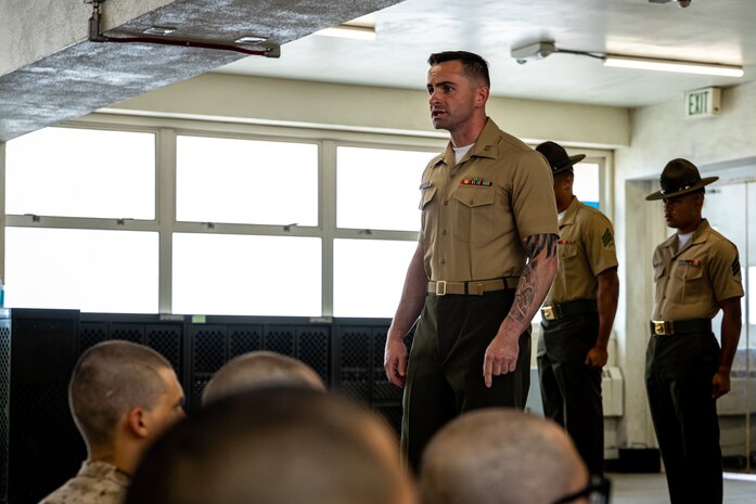 ​U.S. Marine Corps Capt. Matthew Spencer, a series commander for Lima Company, 3rd Recruit Training Battalion, introduces recruits to their drill instructors as part of a pick-up event at Marine Corps Recruit Depot San Diego, California, July 12, 2024. During pick-up recruits meet their drill instructors and are briefed on the rules and expectations of their training. (U.S. Marine Corps photo by Lance Cpl. Eric Valerio)
