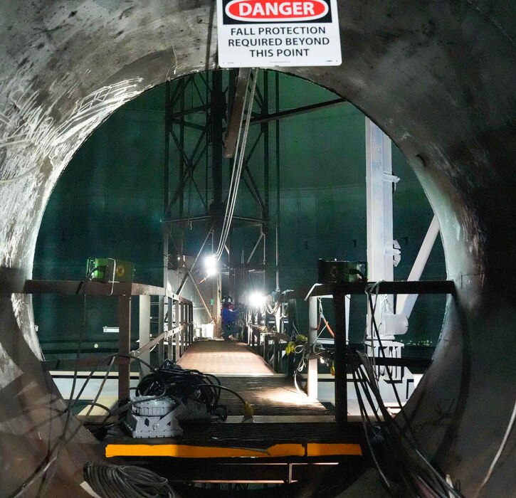 HALAWA, Hawaii (June 26, 2024) A Navy Closure Task Force-Red Hill (NCTF-RH) contractor installs a horizontal lifeline inside fuel tank 8 at the Red Hill Bulk Fuel Storage Facility (RHBFSF) in Halawa, Hawaii, June 26, 2024. The lifeline will be one of three that will allow workers to safely enter and maneuver and begin removing sludge from the interior of the tank. Charged with the safe decommissioning of the RHBFSF, NCTF-RH was established by the Department of the Navy as a commitment to the community and the environment. The Navy continues to engage with the people of Hawaii, regulatory agencies, and other stakeholders as NCTF-RH works to safely and deliberately decommission the RHBFSF. (U.S. Navy photo by Mass Communication Specialist 1st Class Glenn Slaughter)