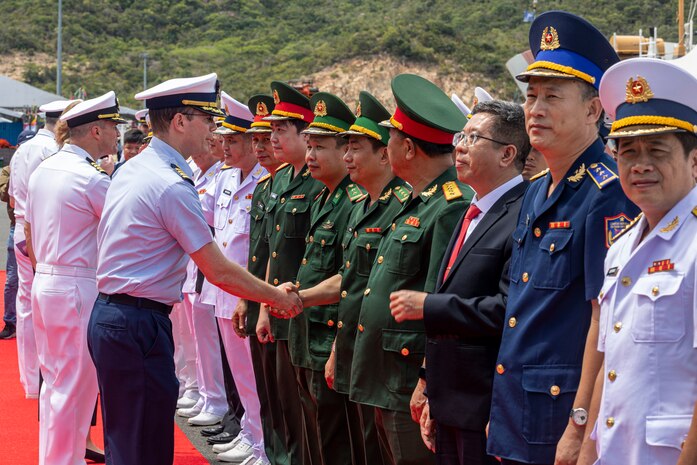 U.S. Coast Guard Capt. Tyson Scofield, commanding officer of the U.S. Coast Guard Cutter Waesche (WMSL 751), shakes hands with leadership from the Vietnamese People’s Army during a reception at the Cam Ranh International Port in Vietnam, July 8, 2024.