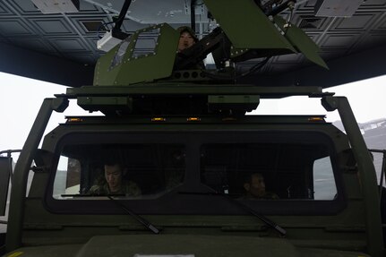 Japanese soldiers with the Amphibious Rapid Deployment Brigade, Japanese Ground Self-Defense Force, test a simulated medium tactical vehicle during a visit on Camp Hansen, Okinawa, Japan, July 11, 2024.