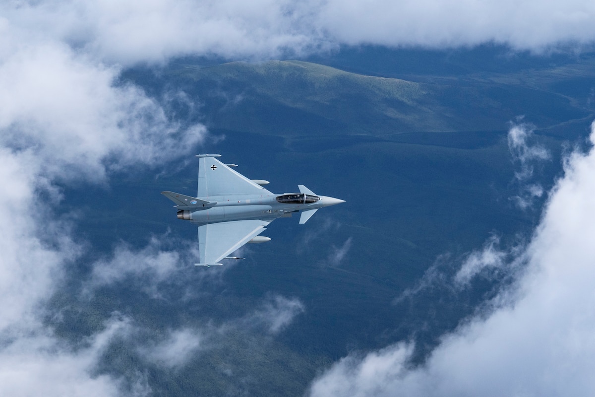 A German Air Force Eurofighter Typhoon flies over Alaska during exercise Arctic Defender 24 at Joint Base Elmendorf-Richardson, Alaska, July 8, 2024. Arctic Defender is a German Air Force-led exercise that provides a unique opportunity to integrate various forces into joint, coalition and multilateral training from simulated forward operating bases and is part of several exercises under Pacific Skies 24. Pacific Skies is a combination of several exercises in the Indo-Pacific theater in which German, French and Spanish air forces participate with U.S. forces. (U.S. Air Force photo Senior Airman Shelimar Rivera Rosado)