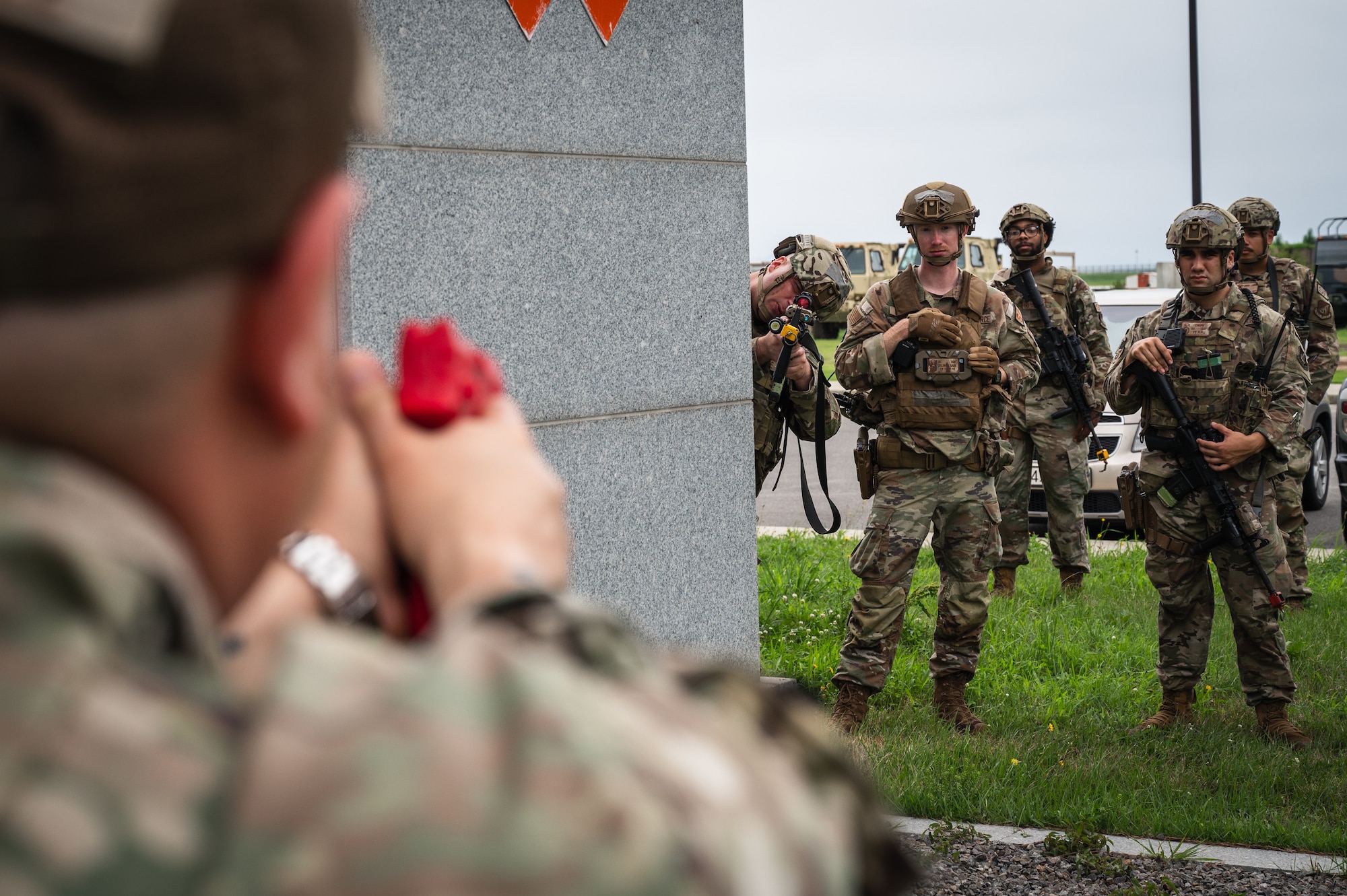U.S. Air Force Tech. Sgt. Daniel Elmore, 8th Security Forces Squadron flight sergeant, shows an example of using angles and proper weapon handling to Defenders during Beverly Sentinel 24-2.