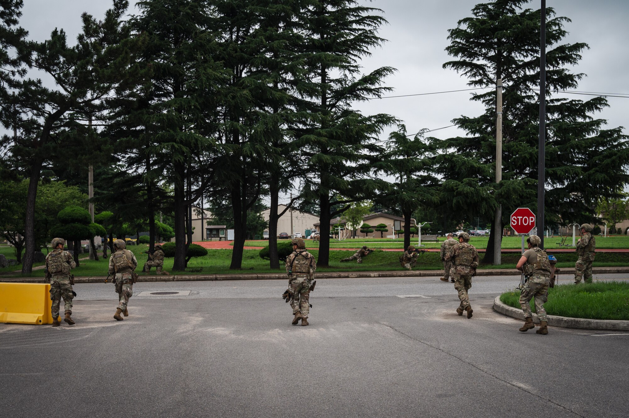 Airmen from the 8th Security Forces Squadron prepare to clear an area in a training scenario during Beverly Sentinel 24-2.