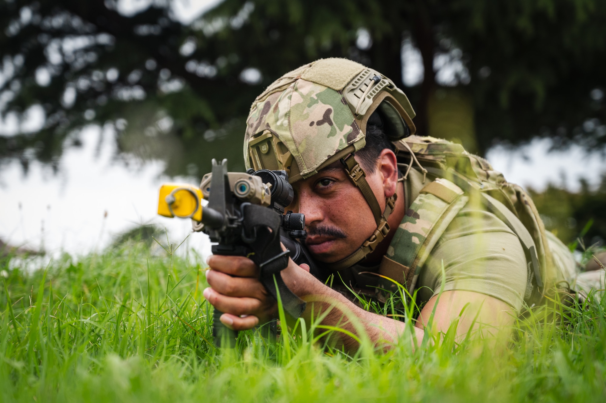 Senior Airman Raymond Madena, 8th Security Forces Squadron defender, keeps guard while in the prone unsupported position in a training scenario during Beverly Sentinel 24-2 .