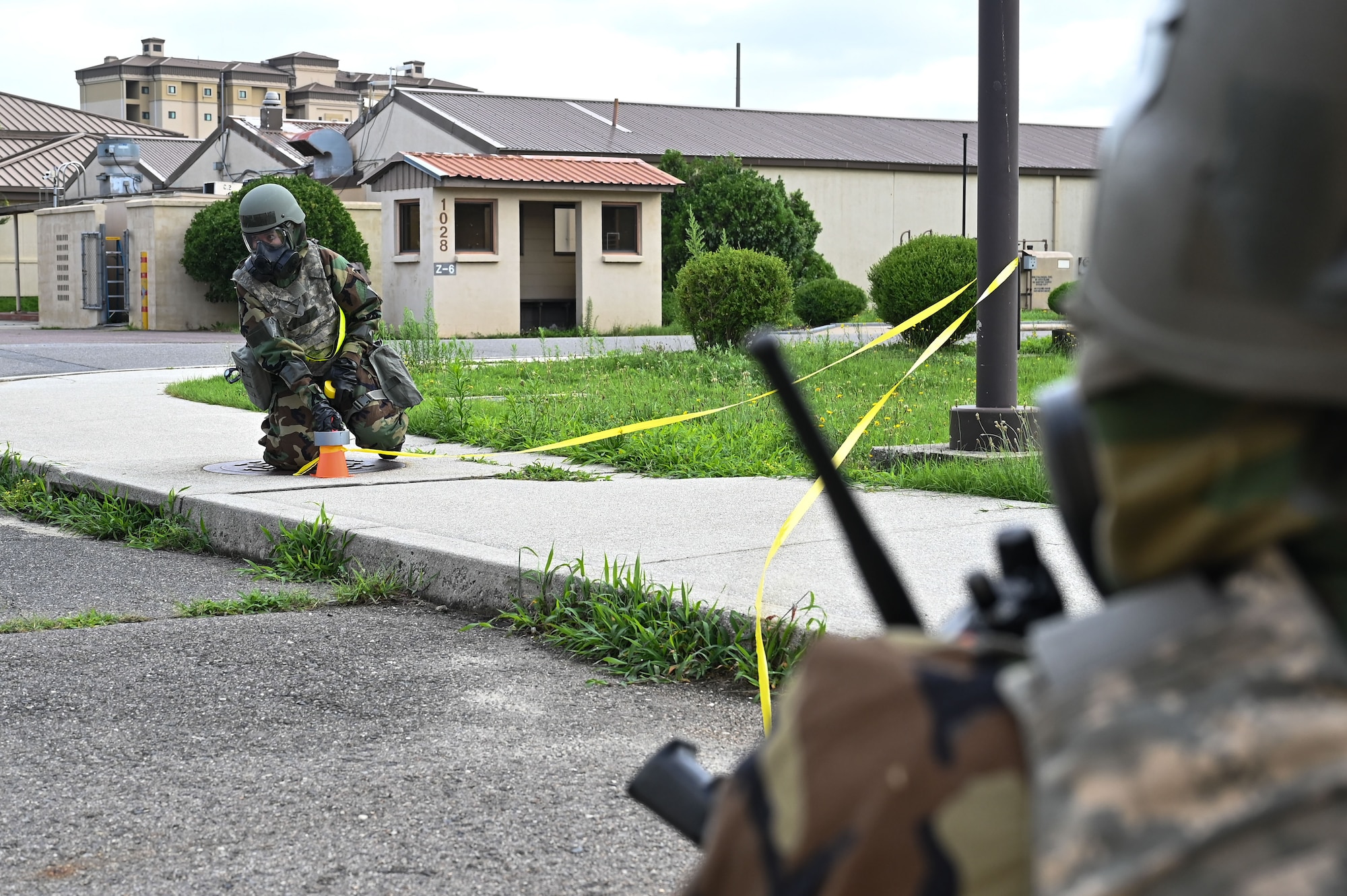 Airman 1st Class Adriana Rodriguez, 8th Force Support Squadron relocations technician, cordons off an area during exercise Beverly Sentinel 24-2.