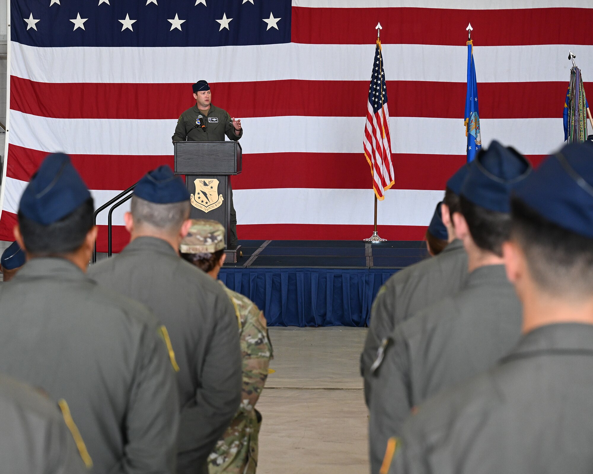 Col. Lofthouse speaks to the crowd of Airmen.