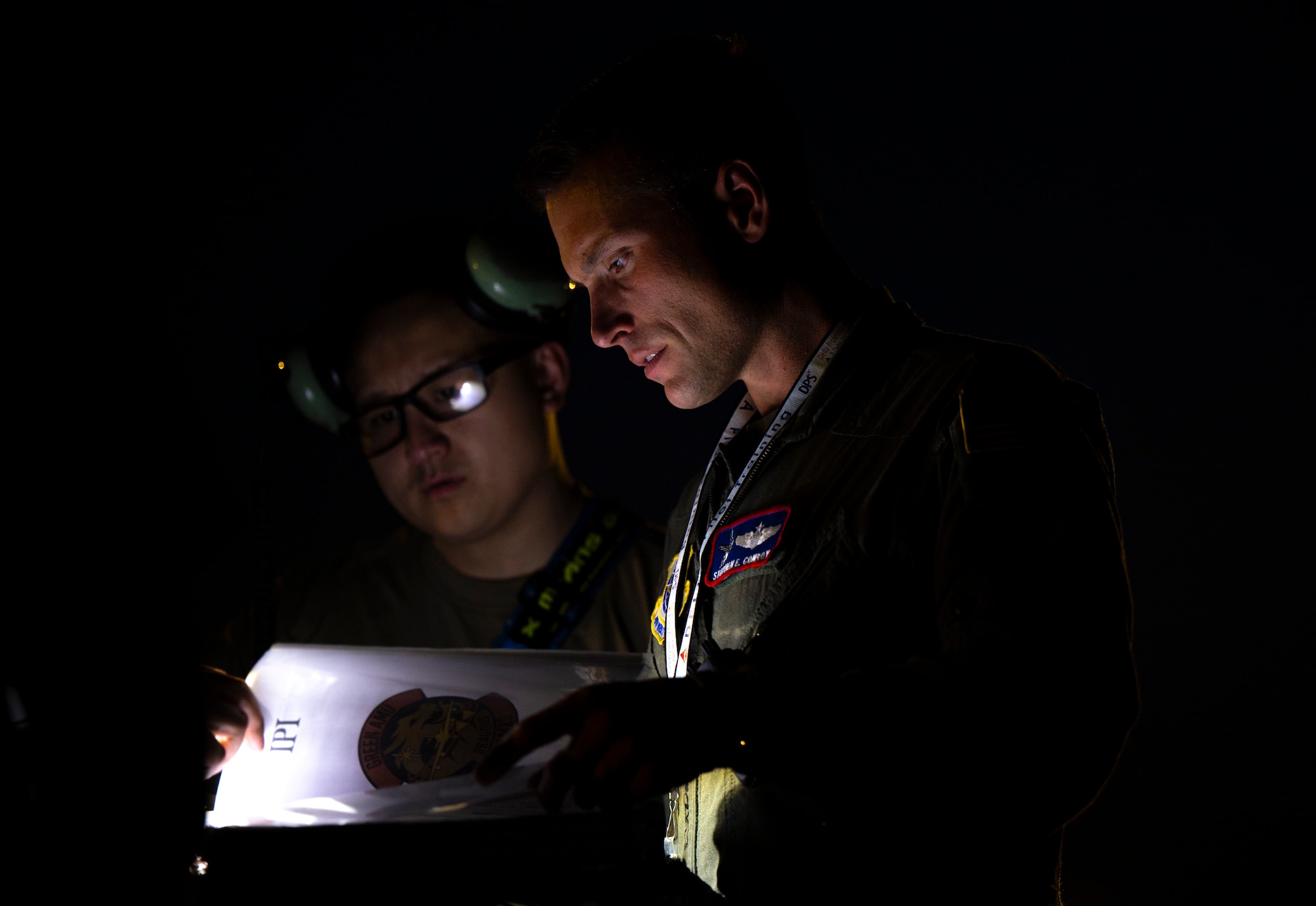A military member prepares to brief