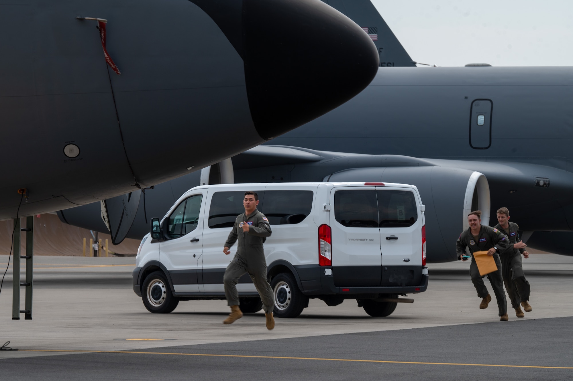 Airmen assigned to the 92nd Air Refueling Wing sprint towards a KC-135 Stratotanker during a no-notice Nuclear Operational Readiness Inspection at Fairchild Air Force Base, Washington, July 17, 2024. Air Mobility Command's Inspector General team conducted the no-notice NORI from July 16 - 18, during which the 92nd Air Refueling Wing and 141st ARW received same-day notification of the evaluation of the base's capability to perform as a nuclear support unit. Various capabilities at Fairchild AFB enable units to generate and provide, when directed, specially trained and equipped KC-135 Stratotanker aircrews to conduct critical air refueling of U.S. Strategic Command-assigned nuclear-capable bombers and Nuclear Command, Control and Communication aircraft. No-notice inspections validate that Airmen are always postured and ready with a credible force to assure, deter and defend in an increasingly complex security environment. No-notice and limited-notice operational readiness assessments and inspections directly support the plans unveiled by senior Department of the Air Force leaders as the force reoptimizes for Great Power Competition. (U.S. Air Force photo by Airman 1st Class Stassney Davis)