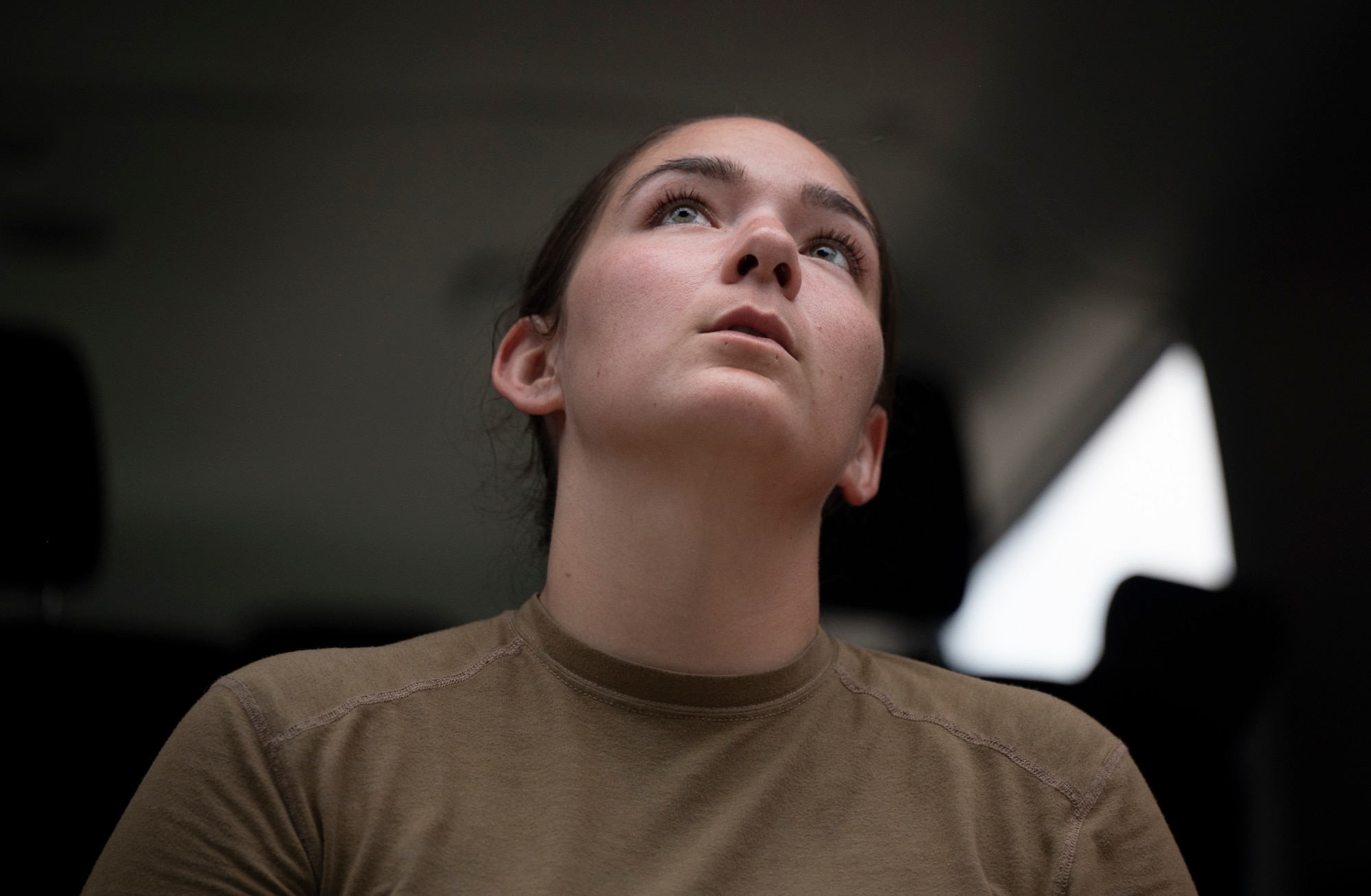 A military member prepares to transport cargo