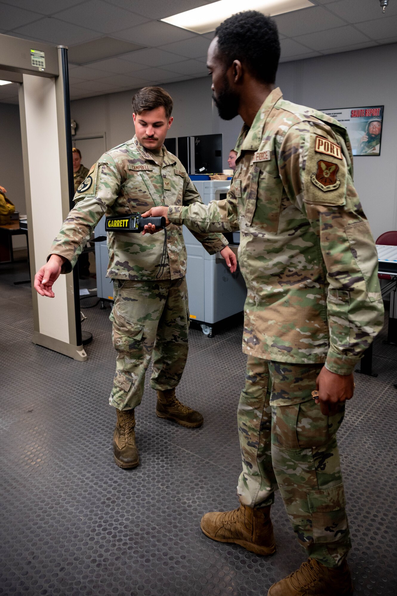 A 5th Logistics Readiness Squadron air transportation specialist uses a metal detector on another Airman while processing passengers in support of exercise AGILE WARBIRD at Minot Air Force Base, North Dakota, June 13, 2024. Air transportation specialists are responsible for securely managing cargo and passengers, and ensuring that everything and everyone on a military aircraft is transported safely and quickly. (U.S. Air Force photo by Senior Airman Alexander Nottingham)
